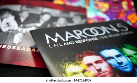 Rome, July 06, 2019: Detail of CDs and artwork of the American pop rock music group MAROON 5. With funk rhythms and typically soul melodies and guitars with dozens of singles in the charts