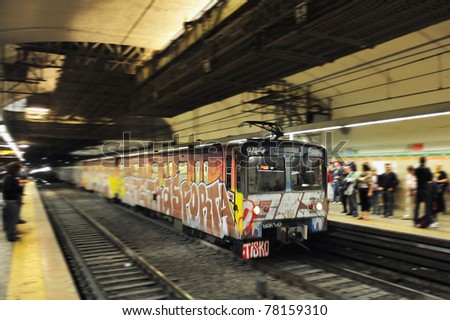 Rome Metro (Metropolitana di Roma Metro system) underground train pulls into a station covered in graffiti in Rome, Italy. It started operation in 1955, making it the oldest in the country. 