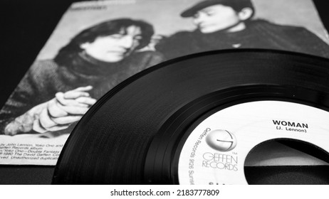 Rome, November 16, 2019: Cover And 45 Rpm Of The Single WOMAN By John Lennon From 1981. He Hears His Wife Yoko Ono And The First Posthumous Release After Lennon's Death On December 8th 1980