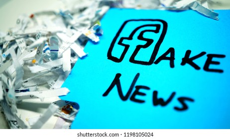 Rome, October 05, 2018: Facebook Logo As F Of Fake News On Blue Sticker, With Scraps Of Paper