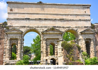 Rome, Porta Maggiore with the ancient aqueduct on it. View and detail - Shutterstock ID 1149491957