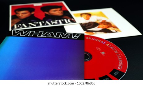 Rome, September 07, 2019: CDs and artwork of the pop duo WHAM!, established in 1981 by singer and composer George Michael and guitarist Andrew Ridgeley, disbanded in 1986