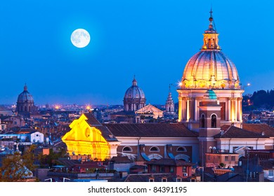 Rome Skyline At Night. In The Foreground San Carlo Al Corso Church.