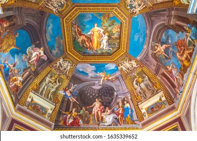 Rome, Vatican City / Italy - 2019/06/15: Apollo and the Muses fresco by Tommaso Conca and other ceiling frescos in the Muses Room within the Vatican Museums - Musei Vaticani - in the Vatican City