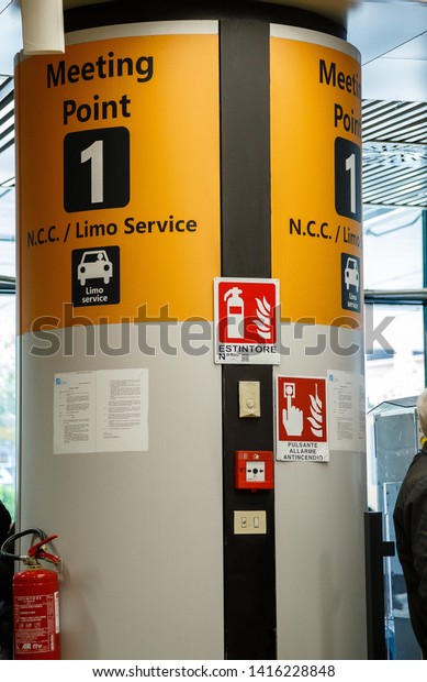 Rome,Europe/Italy - May 5 2019: the Fiumicino\
airport ,Post , meeting point for arriving tourists, transfer,\
yellow sign with the inscription and the logo of the car company\
Limo service