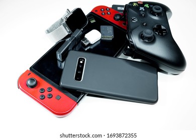 Rome,italy - April 4 2020: Pile Of Hi Tech Devices,console Gaming, Xbox Controller,smartphone,addiction