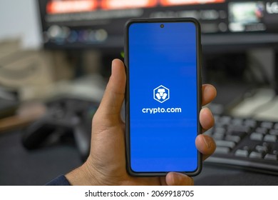 Rome,italy - November 4 2021: Man Use Crypto Currency App On A Smartphone,trading Exchange,digital Business,crypto.com