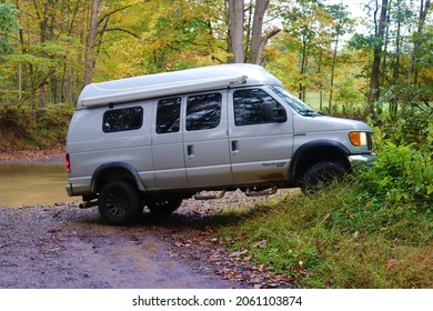 Romney, West Virginia, USA - October 10 2021: Sport Van In A Tough Terrain.