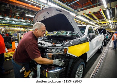 Ron Williams attaches a grill at GM's Chevrolet Silverado and GMC Sierra pickup truck plant in Fort Wayne, Indiana, U.S., July 25, 2018. Picture taken on July 25, 2018.