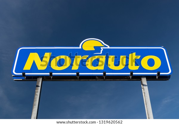 RONCQ,FRANCE-February 20,2019:\
Norauto brand logo on a blue sky background.Norauto is a French\
based company group which focuses on car repairs, car accessories\
and car\
parts.