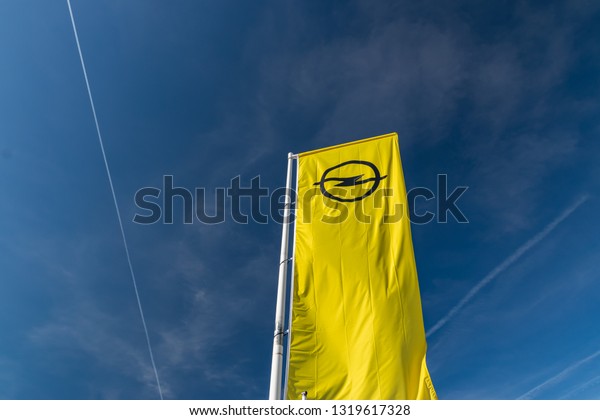 RONCQ,FRANCE-February\
20,2019:View of the Opel brand logo on the flag.Opel Automobile\
GmbH is a German company dealing in the production of passenger\
vehicles and delivery\
vans.