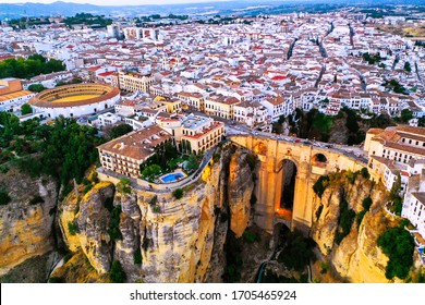 Ronda, Spain. Aerial evening view of New Bridge over Guadalevin River in Ronda, Andalusia, Spain. View of the touristic city with arena at the background