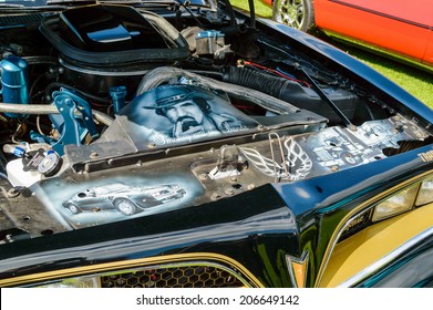 RONNEBY, SWEDEN - JULY 17, 2014: Press show for upcoming event "Pony and muscle car meet". Paintings under hood of Pontiac Trans Am with "Smokey and the bandit".