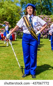 Ronneby, Sweden - June 6, 2016: The Swedish National Day Celebration In Public Park. The Female Drum Major In Ronneby School Orchestra (skolorkester) Holding A Mace In Gloved Hand.