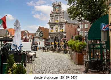 Roode Steen square with ancient Town hall and statue of Jan Pieterszoon Coen