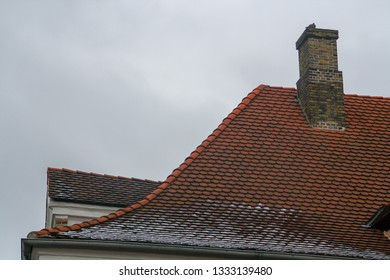 Roof And Chimney On A Cold Wintry Day, Copenhagen, Denmark. Detail Of The Steep Slope Of The Roof To Avoid The Accumulation Of Snow.