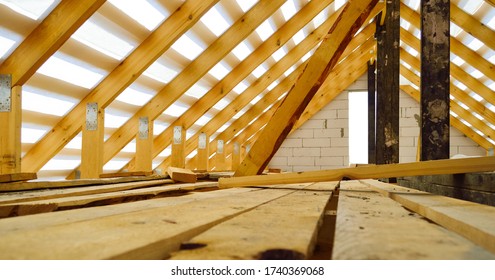 Roof Construction - A Wooden Roof Frame Covered With A Waterproofing Film, Fixing Rafters, Beams, Racks