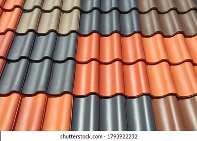 A roof is covered with different colored roof tiles.