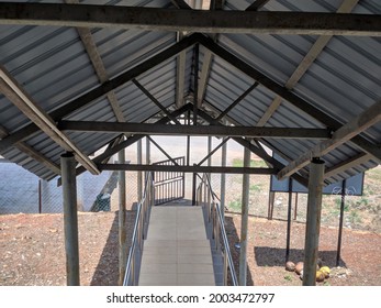 Roof Covers Walkway On Steep Slope