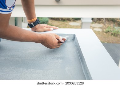 Roof floor or deck painting work consist of painter man or worker person, bristles brush. That house construction to coating surface concrete with waterproof and colour by professional, contractor.
