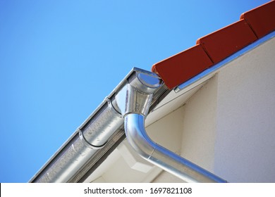 Roof Gutter On A New Tiled Roof