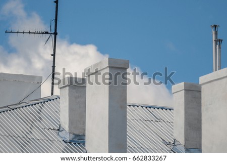 roof house with chimney against the sky, background