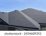 Roof of the house made of bitumen roof shingles aerial view