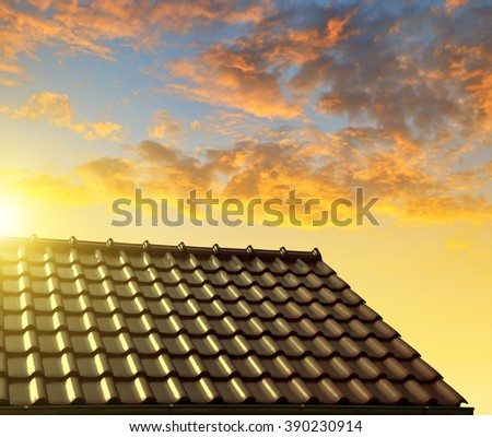Roof house with tiled roof at sunset