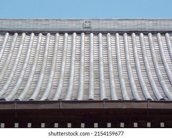 The roof of a Japanese temple with aligned tiles