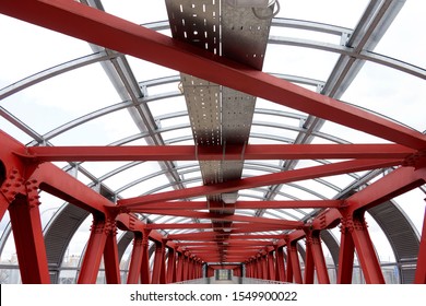 The Roof Is Made Of Steel Channels Connected To Each Other. Red Iron Beams On Bolts And Rivets. Crosswalk, Construction.