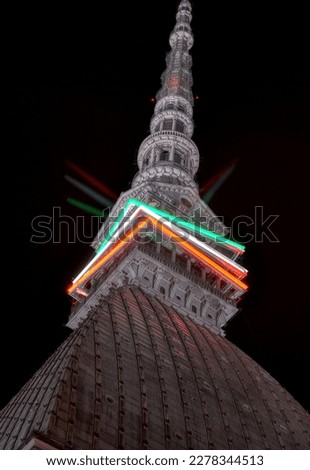 roof of the Mole Antonelliana, at night, with the lights on which symbolize the Italian flag tricolor, Turin, Piedmont, Italy