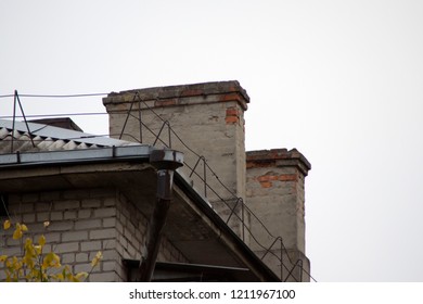 the roof of an old brick house