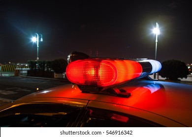 Roof Of Police Car At Night, Lights Flashing