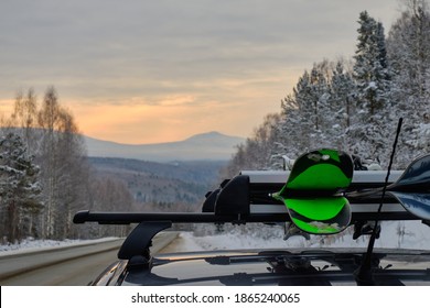 Roof Rack Of A Ski And Snowboard Car With A Mountain Background In Winter