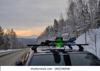 Roof Rack Of A Ski And Snowboard Car With A Mountain Background In Winter