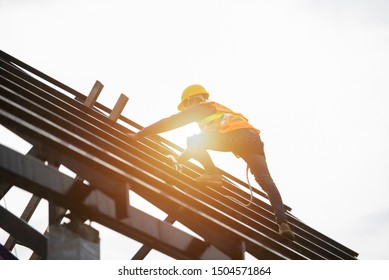 Roof repairman, construction engineer wearing safety inspection kit in Asia