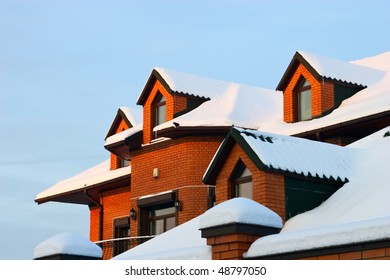 Roof Of Residential House In Winter With Snow.