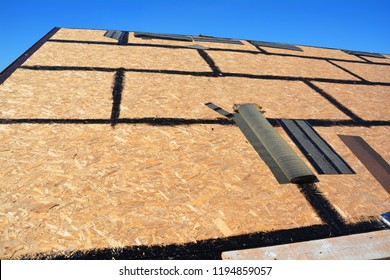 Roof shingles - roofing construction, house roofing repair with asphalt shingles - Shutterstock ID 1194859057