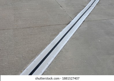 roof structure or bridge expansion for safe connection of two expandable concrete bodies. rubber joint in a metal bar - Shutterstock ID 1881527407