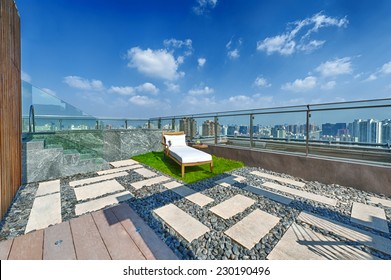 Roof terrace with jacuzzi and sun lounger during day