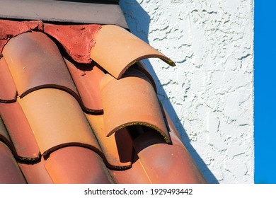 Roof Tiles Dislodged By Strong Winds During Storm Require Repair To Prevent Water Leak And Interior Damage.