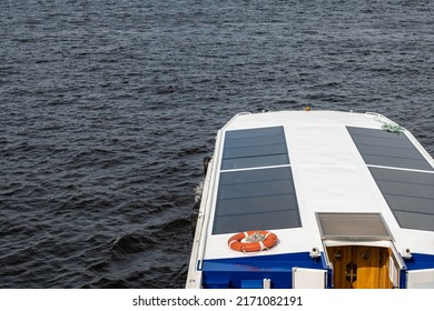 The Roof Of A White Passenger Boat With Large Windows On The Background Of Water. A Place To Print Text. A Lifebuoy On The Roof Of The Ship.