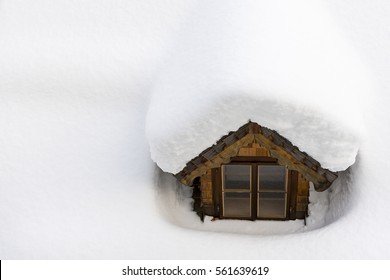 Roof Window Covered With Winter Snow. Thermal Insulation Concept.