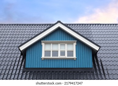 Roof window in velux style with roof tiles - icelandic architecture