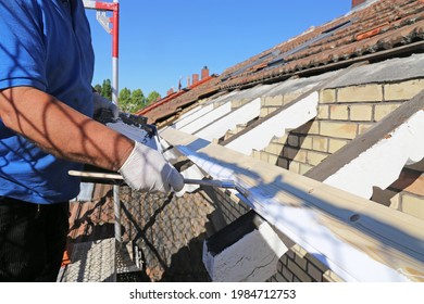 Roofer Attaching The Formwork In The Course Of Re-roofing A Listed Tiled Roof