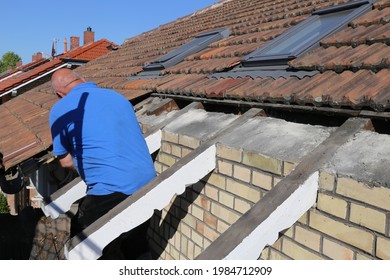 Roofer Attaching The Formwork In The Course Of Re-roofing A Listed Tiled Roof