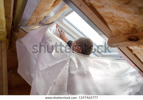 Roofer Builder Worker Installing Vapor Barrier Stock Photo