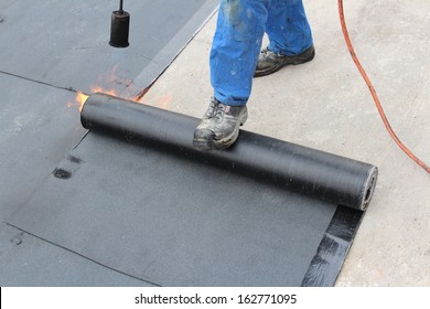 Roofer On A Flat Roof