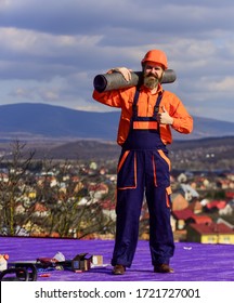 Roofer Repair Roof. Roof Installation. Man Hard Hat Work Outdoor Landscape Background. Building House. Apply Plastic Coatings Membranes Fiberglass Or Felt Over Sloped Roofs Before Applying Shingles.