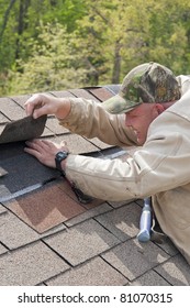 Roofer Repairing Storm Damage On Customers Home After Strong Wings And Hail Over Night Damaged Roof